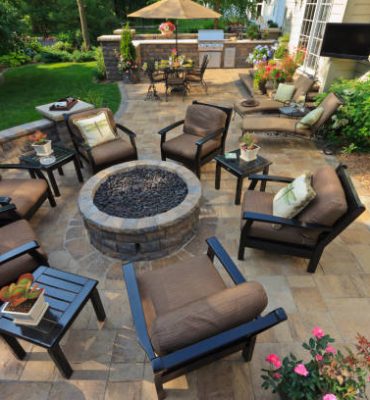 Back yard gardens and patio from an elevated view.