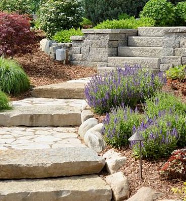 A professional landscaping job with stone path and stone steps.
